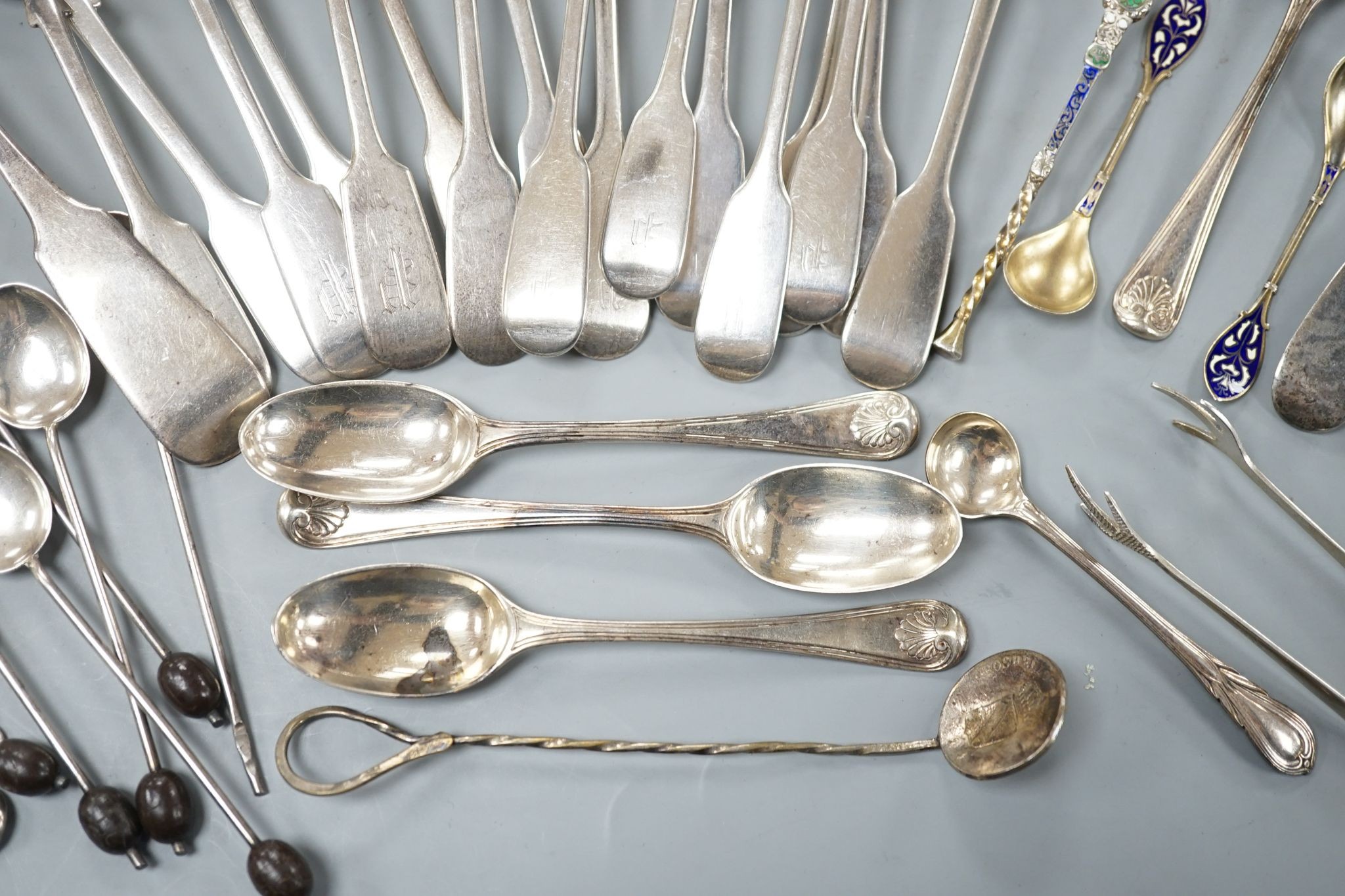 A set of twelve Victorian silver fiddle pattern teaspoons, London, 1870, a pair of Victorian sauce lades and a quantity of assorted sundry silver flatware